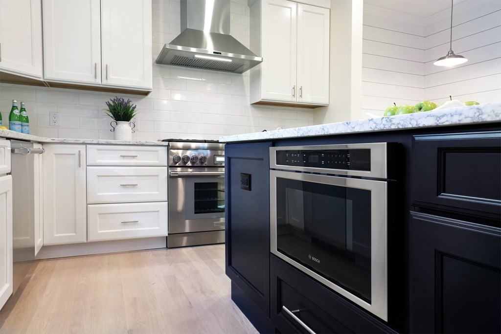 134 Spiers Road Newton, MA 02459 - Photo 9 of 38 a kitchen with stainless steel appliances granite countertop a stove and a refrigerator