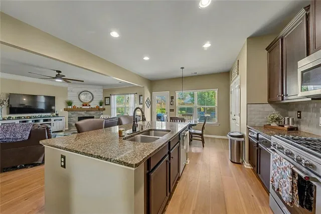 a spacious bedroom with a bed and a ceiling fan