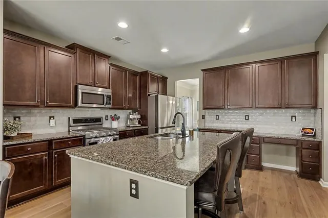 a bedroom with a bed and chair