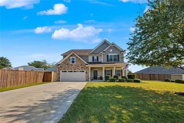 a view of swimming pool with an outdoor space and barbeque oven in the back