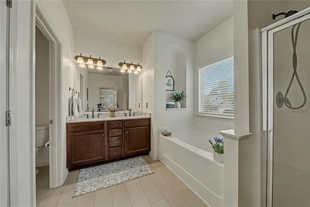 a view of a house with swimming pool and sitting area