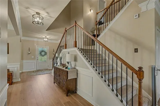 a living room with furniture a fireplace and a floor to ceiling window