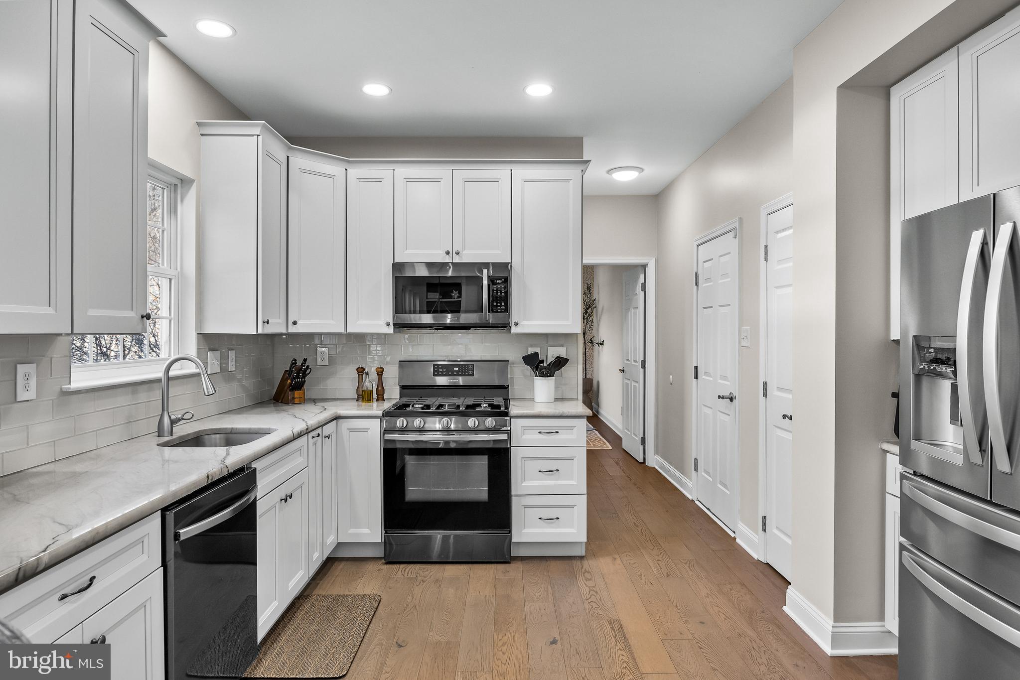 4907 Church Road Mount Laurel, NJ 08054 - Photo 15 of 49 a kitchen with stainless steel appliances granite countertop a stove a sink and a refrigerator
