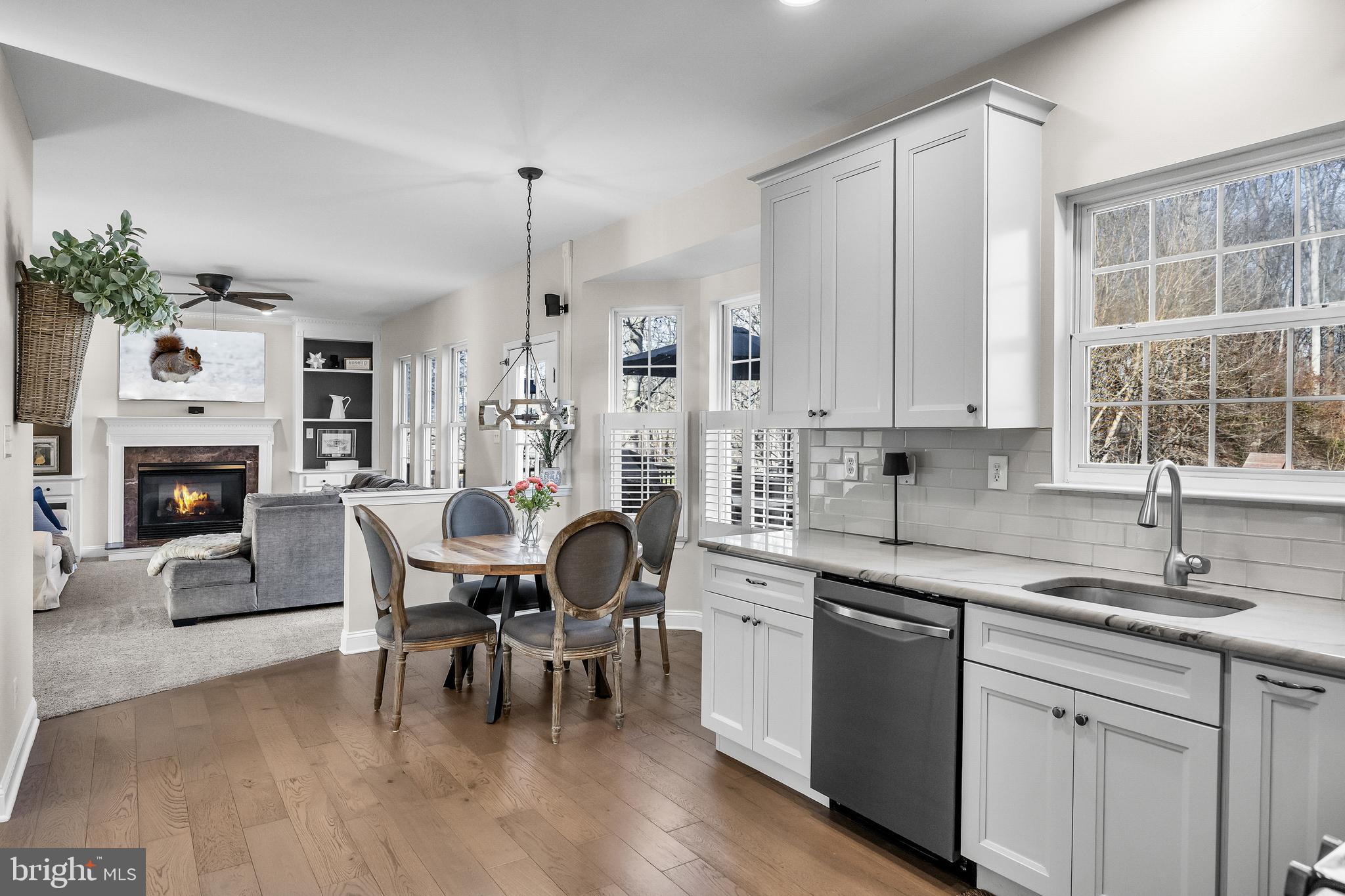 4907 Church Road Mount Laurel, NJ 08054 - Photo 17 of 49 a kitchen with a dining table chairs and white appliances