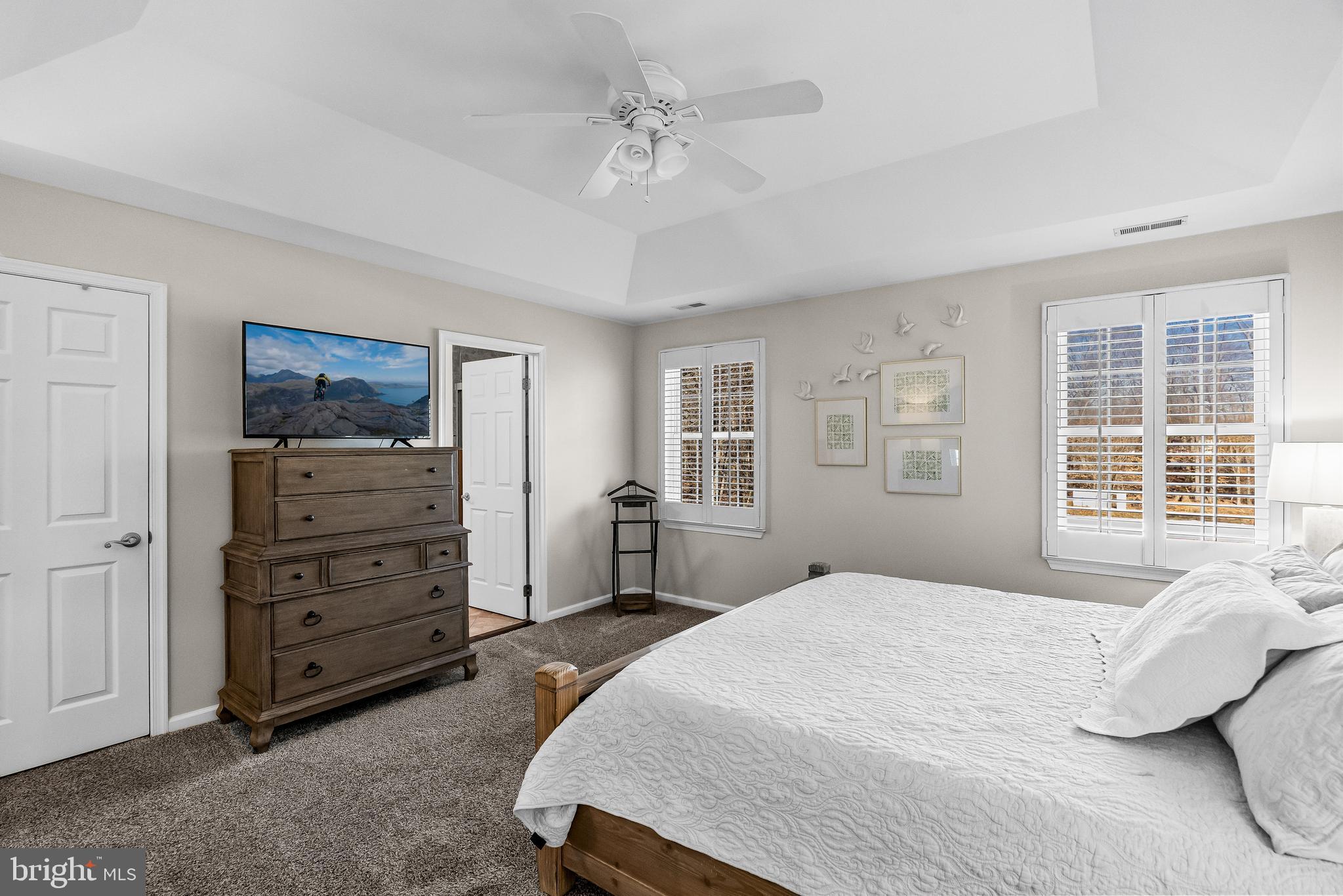 4907 Church Road Mount Laurel, NJ 08054 - Photo 22 of 49 a spacious bedroom with a bed a dresser and a window