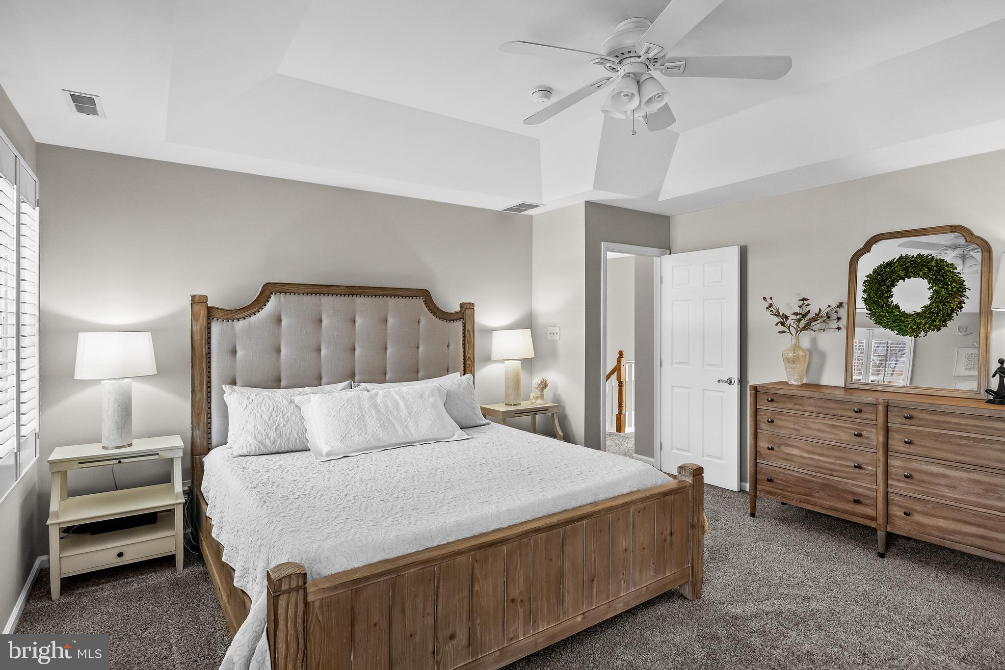 4907 Church Road Mount Laurel, NJ 08054 - Photo 24 of 49 a bedroom with a bed and a chandelier