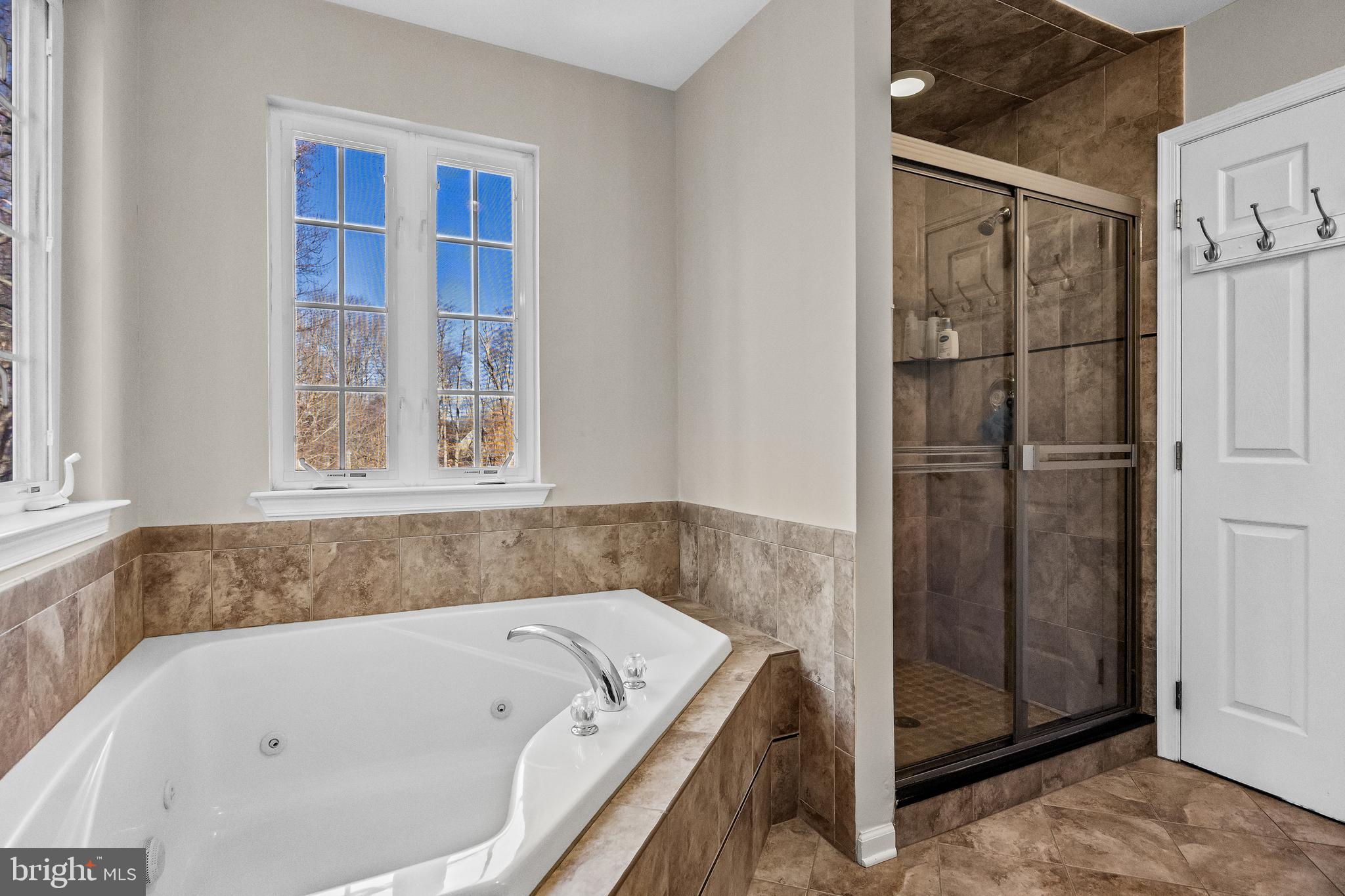 4907 Church Road Mount Laurel, NJ 08054 - Photo 26 of 49 a bathroom with a tub and a shower