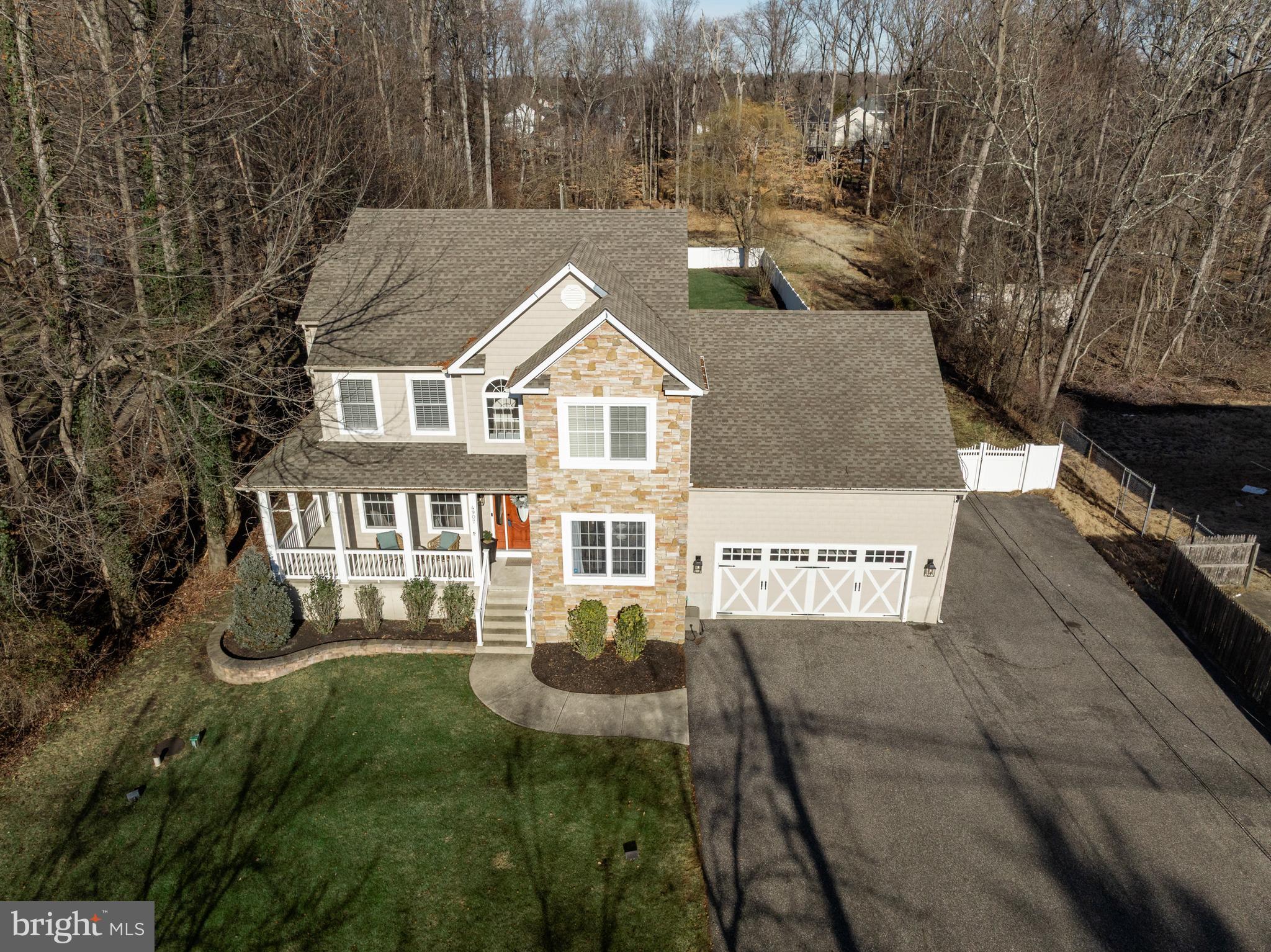 4907 Church Road Mount Laurel, NJ 08054 - Photo 43 of 49 a front view of a house with a yard and lake view