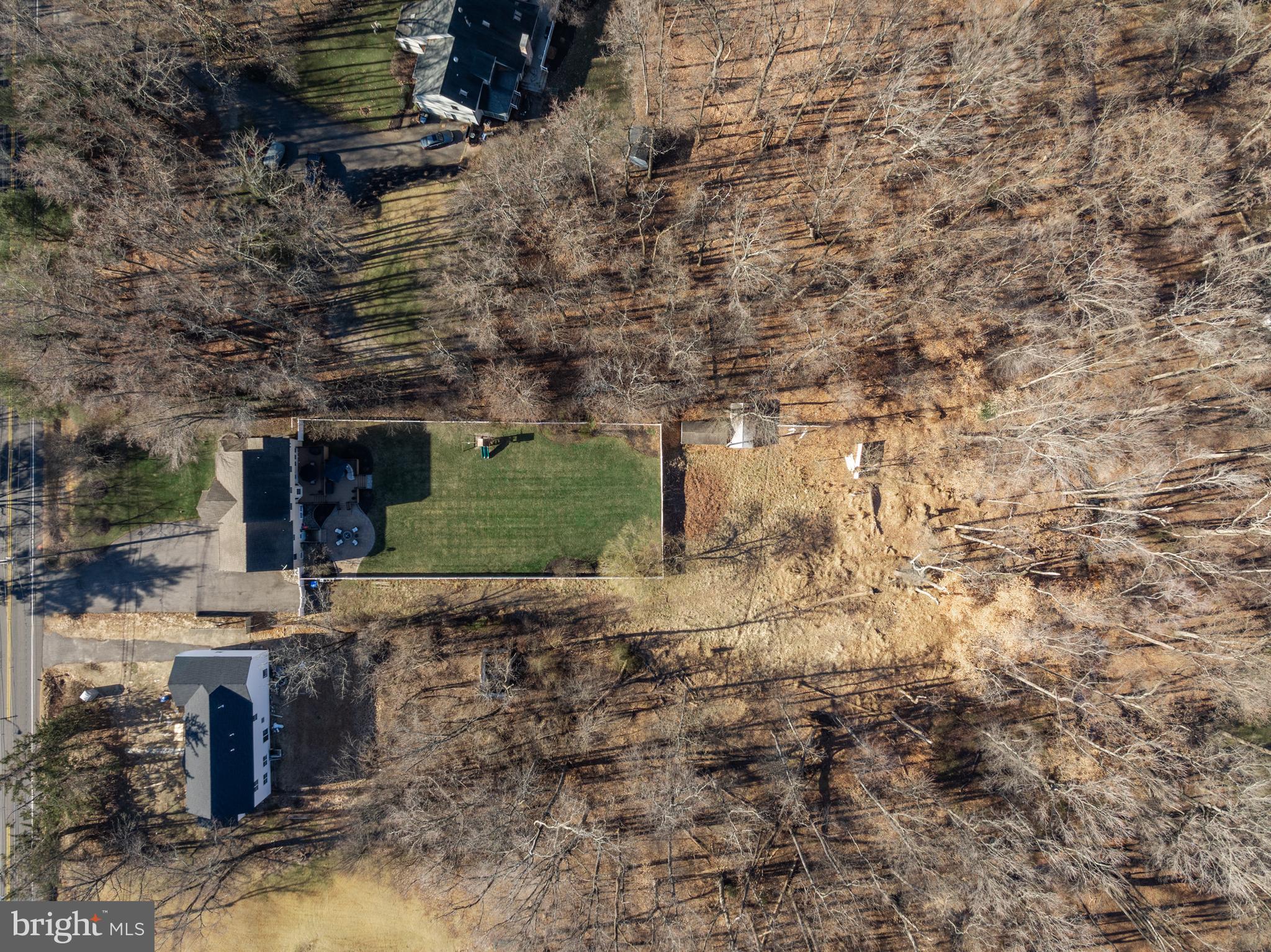4907 Church Road Mount Laurel, NJ 08054 - Photo 46 of 49 a backyard of a house with a garden and covered with tall trees