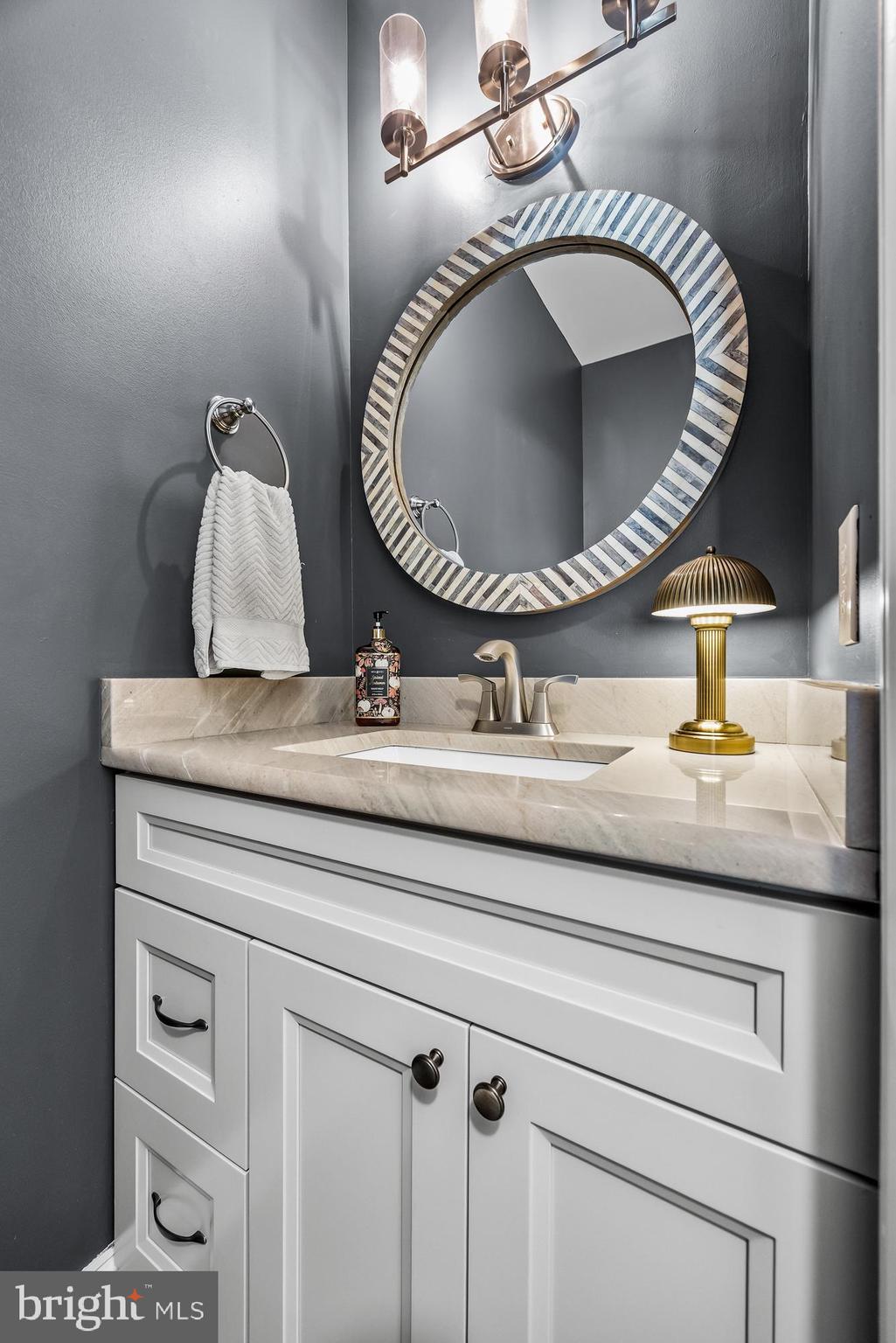 4907 Church Road Mount Laurel, NJ 08054 - Photo 9 of 49 a bathroom with a sink and mirror