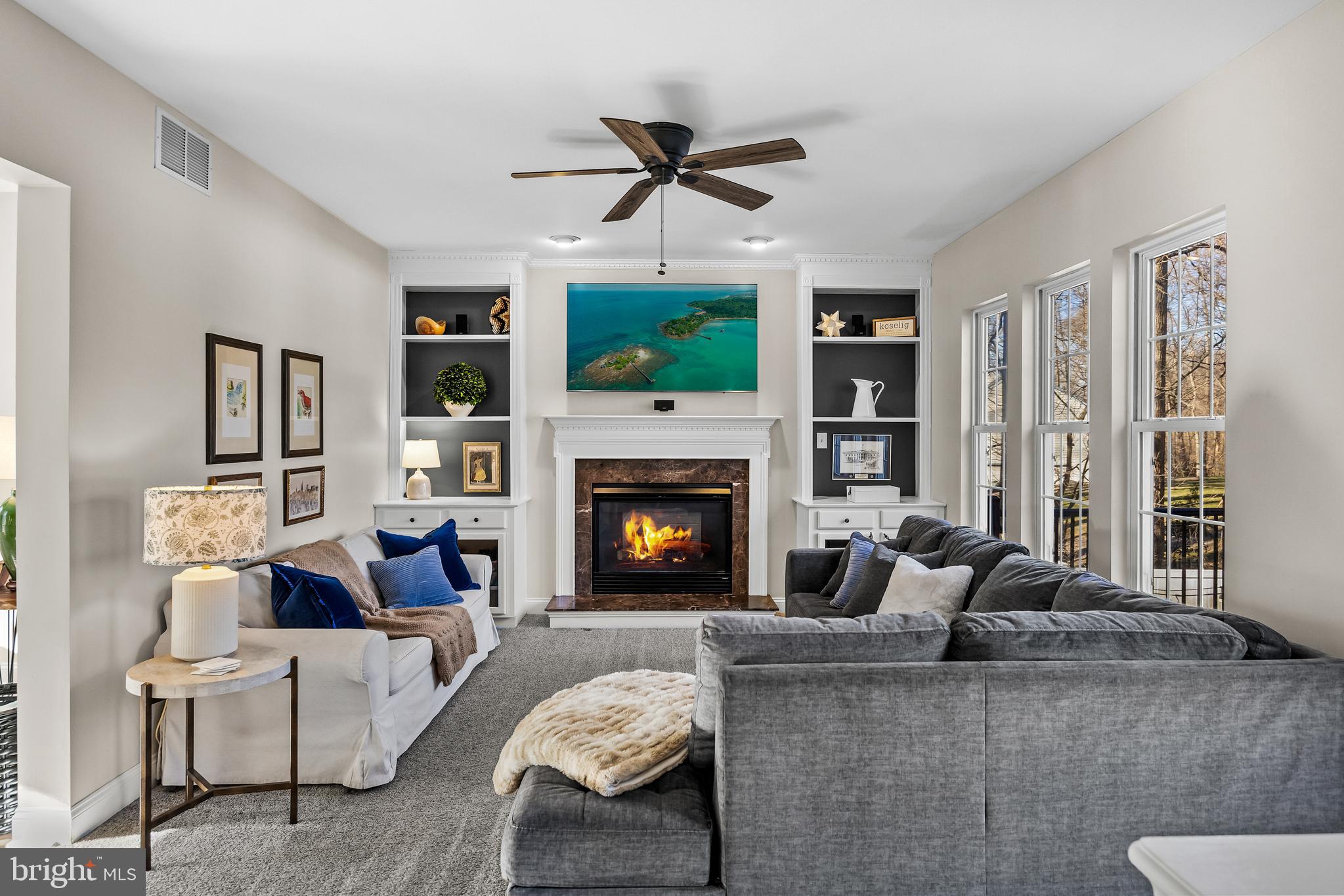 4907 Church Road Mount Laurel, NJ 08054 - Photo 10 of 49 a living room with furniture a flat screen tv and a fireplace