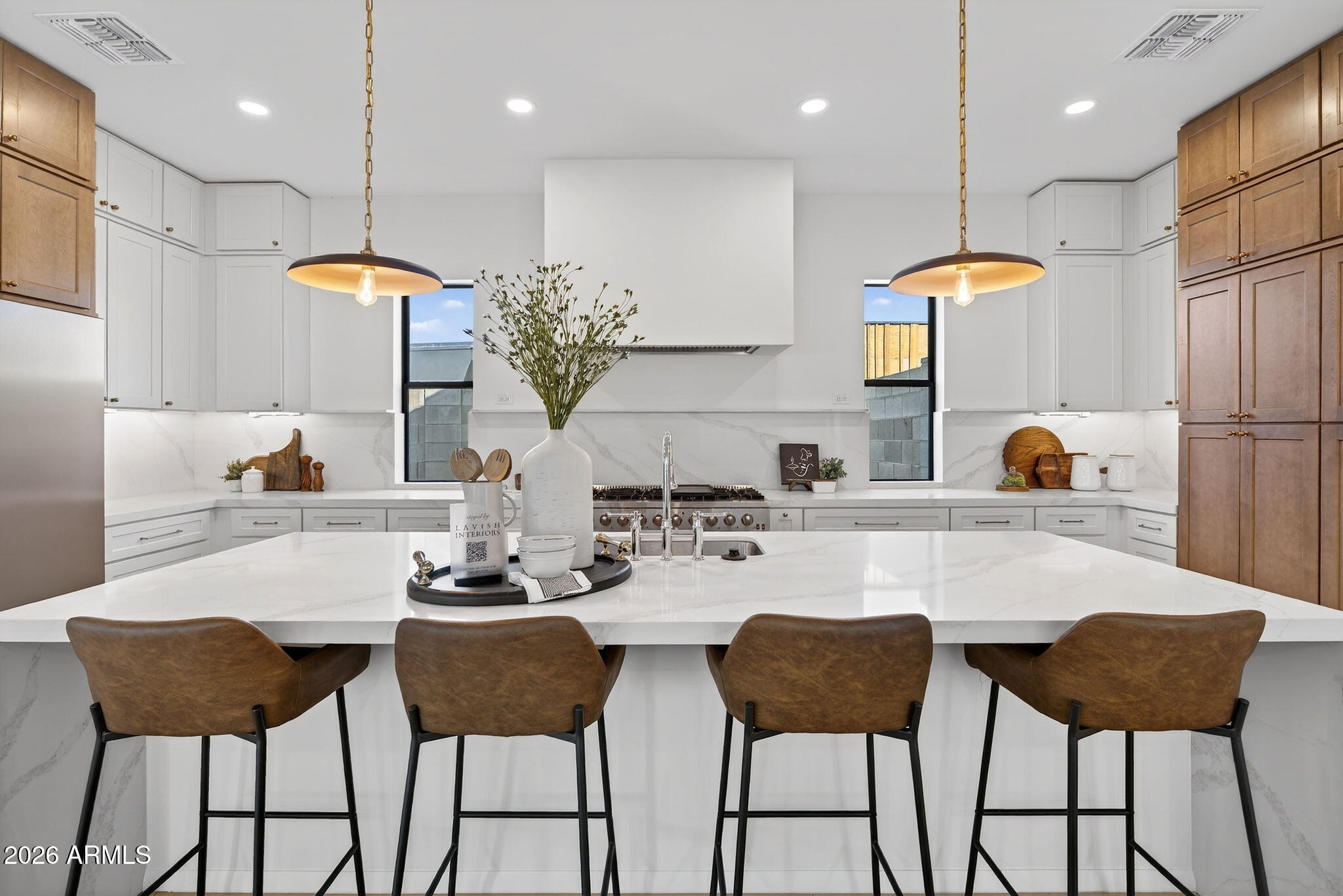 6818 North 13th Street Phoenix, AZ 85014 - Photo 15 of 65 a kitchen with a dining table chairs and refrigerator