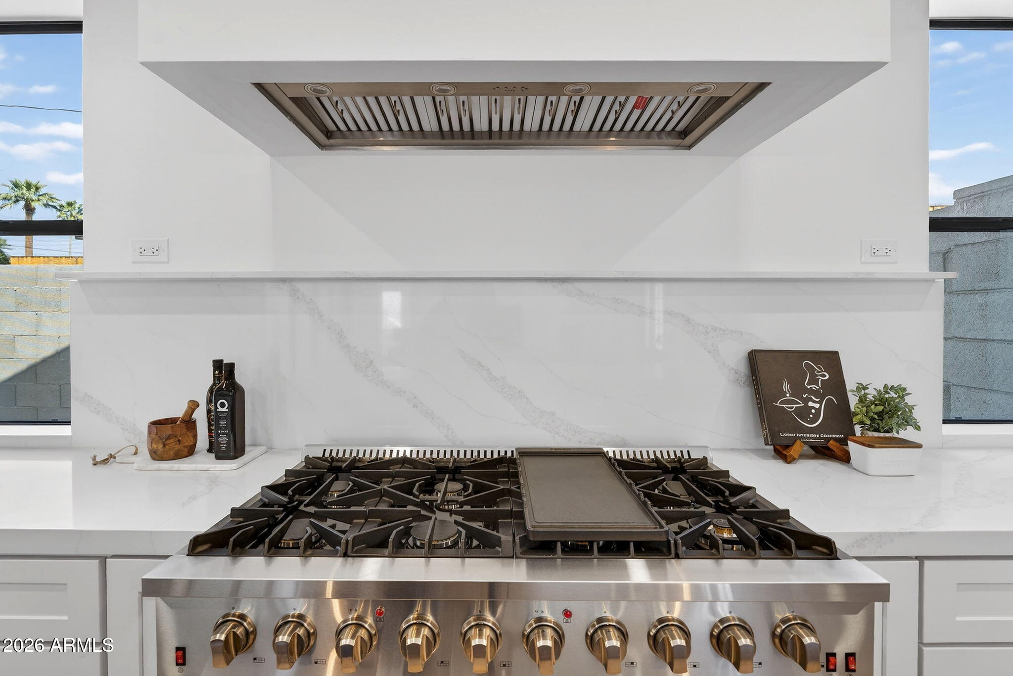 6818 North 13th Street Phoenix, AZ 85014 - Photo 21 of 65 a kitchen with a stove and a white cabinets