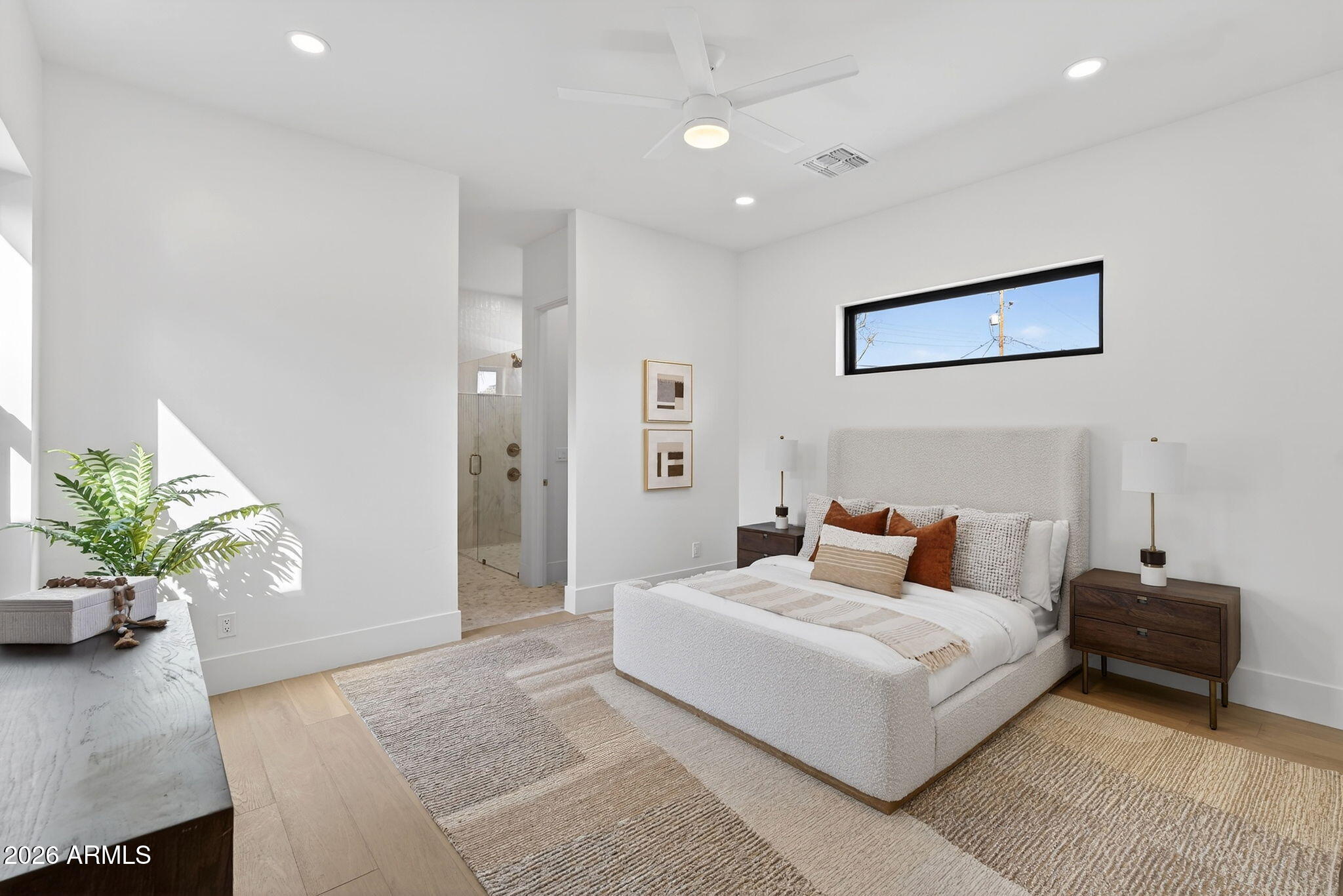 6818 North 13th Street Phoenix, AZ 85014 - Photo 26 of 65 a bedroom with a bed and a couch