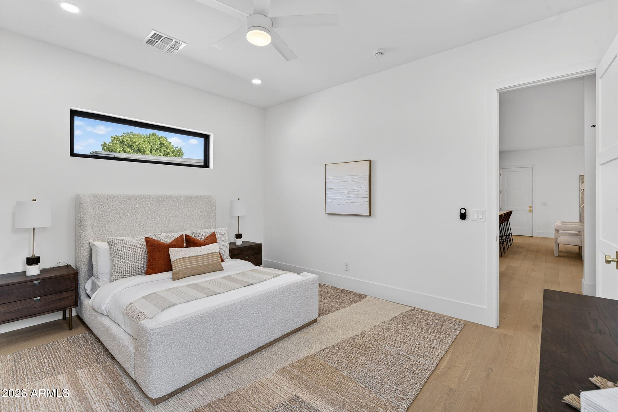 6818 North 13th Street Phoenix, AZ 85014 - Photo 27 of 65 a bedroom with a large bed and a couch