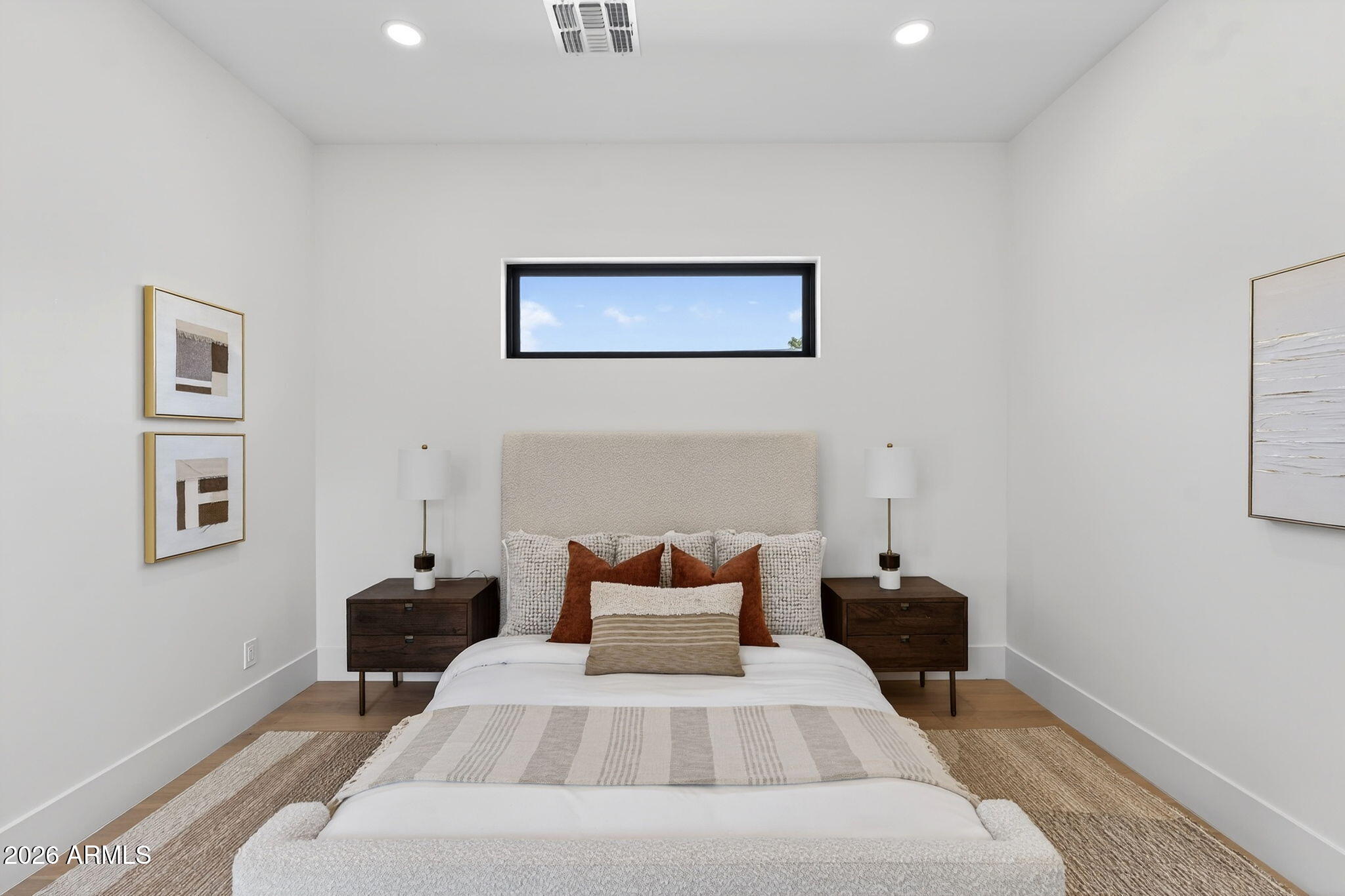 6818 North 13th Street Phoenix, AZ 85014 - Photo 31 of 65 a bed room with a bed and a chair