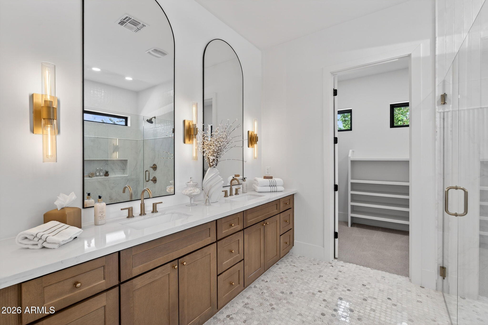 6818 North 13th Street Phoenix, AZ 85014 - Photo 34 of 65 a spacious bathroom with a double vanity sink a mirror and a shower