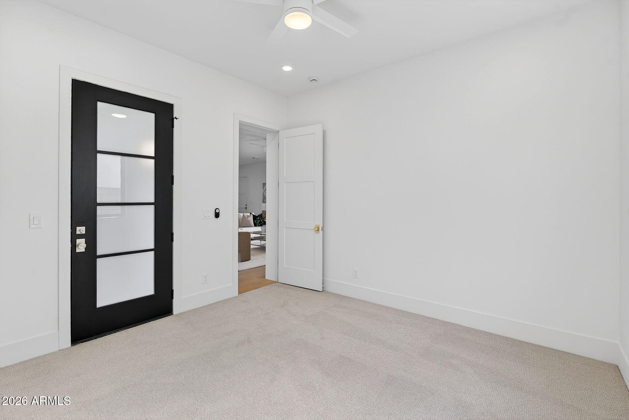 6818 North 13th Street Phoenix, AZ 85014 - Photo 40 of 65 an empty room with mirror and entrance