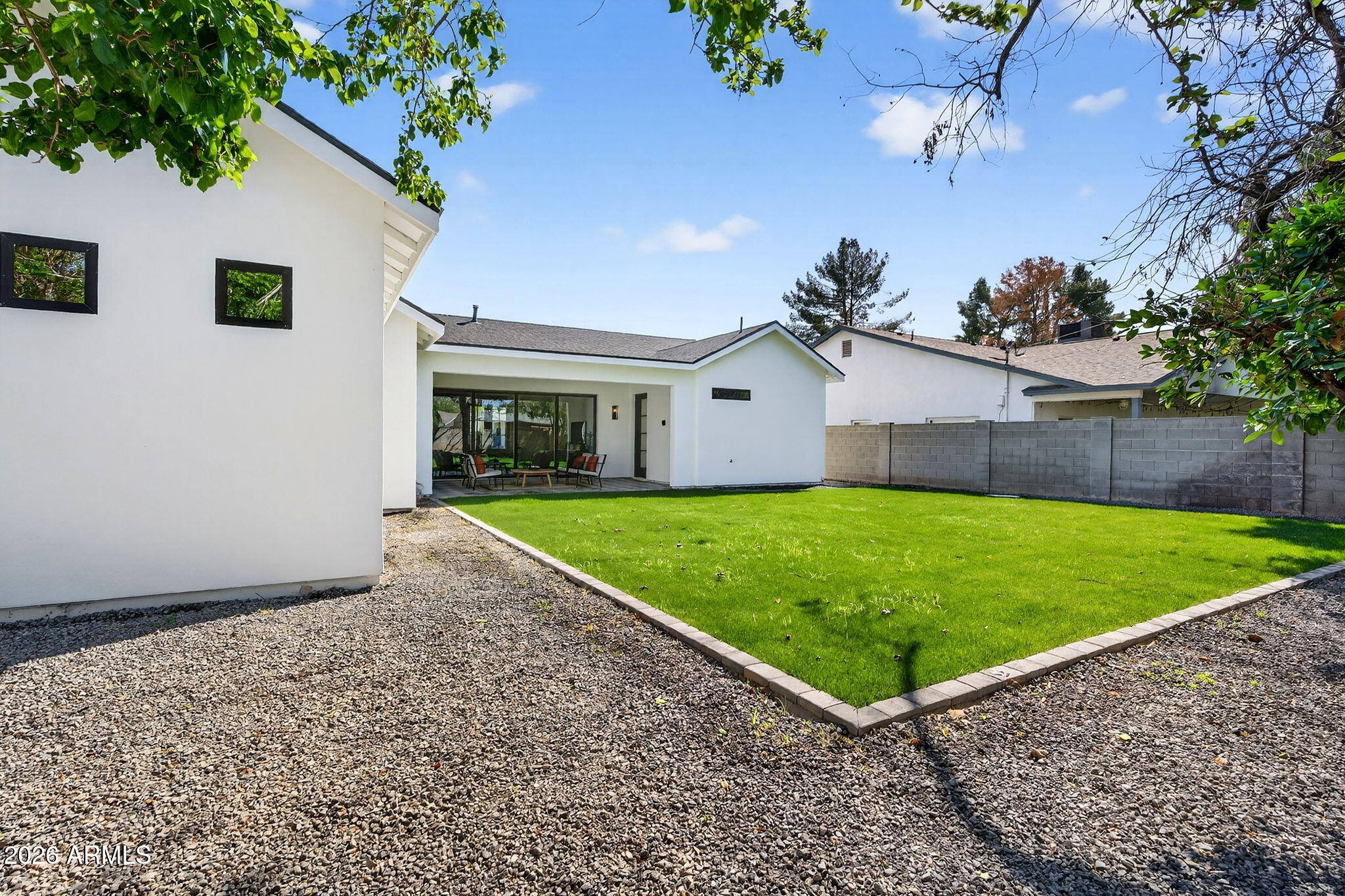 6818 North 13th Street Phoenix, AZ 85014 - Photo 55 of 65 a view of a house with a backyard