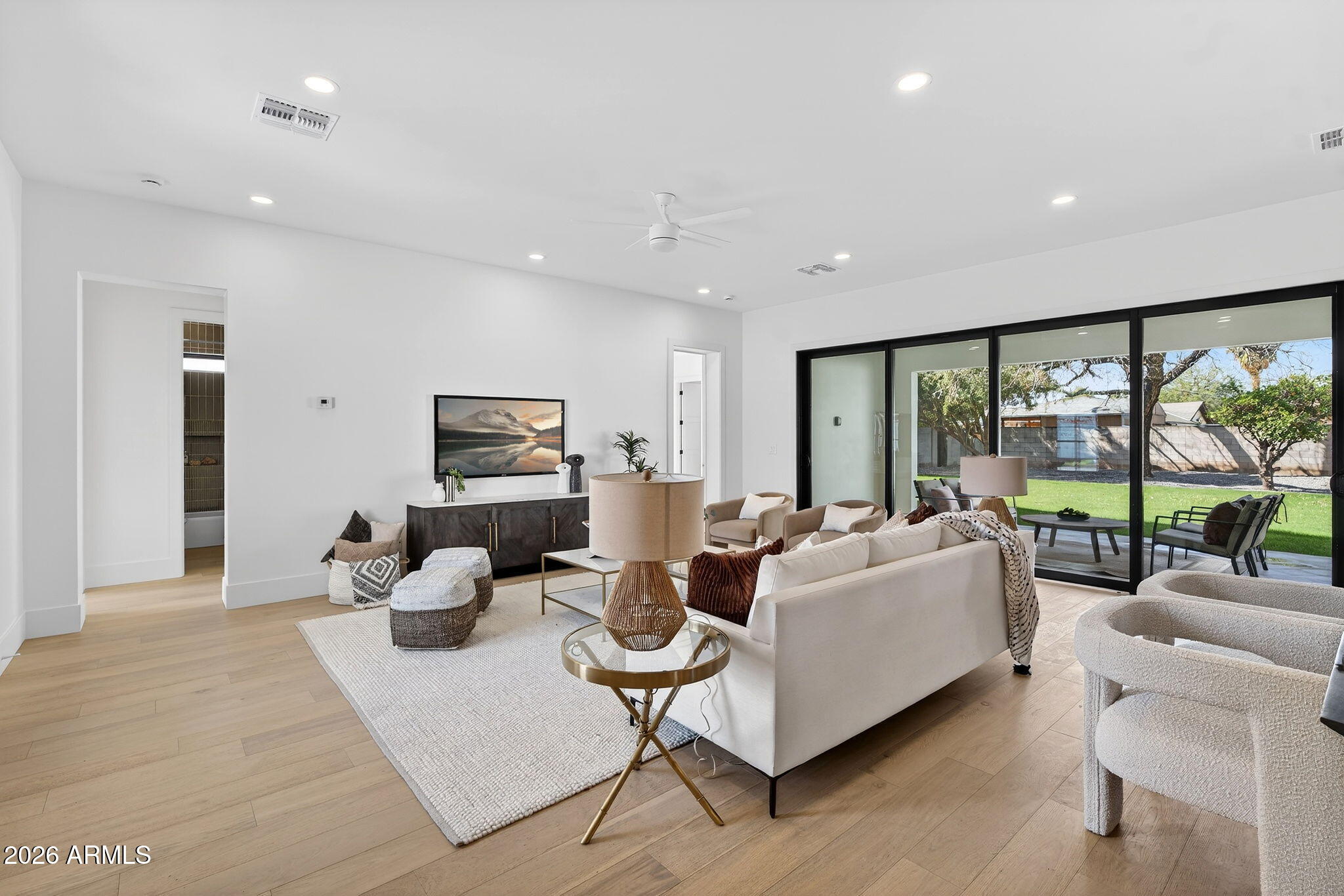 6818 North 13th Street Phoenix, AZ 85014 - Photo 8 of 65 a living room with fireplace furniture and a large window