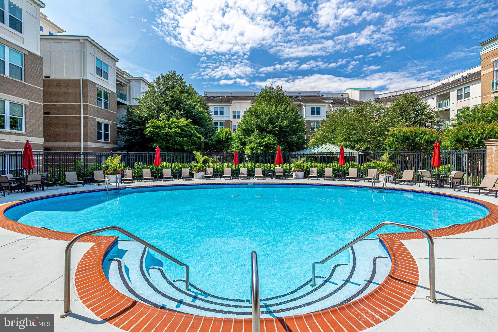 12000 Market Street, Unit 343 Reston, VA 20190 - Photo 37 of 46 Lovely pool and lounge chairs with umbrellas!