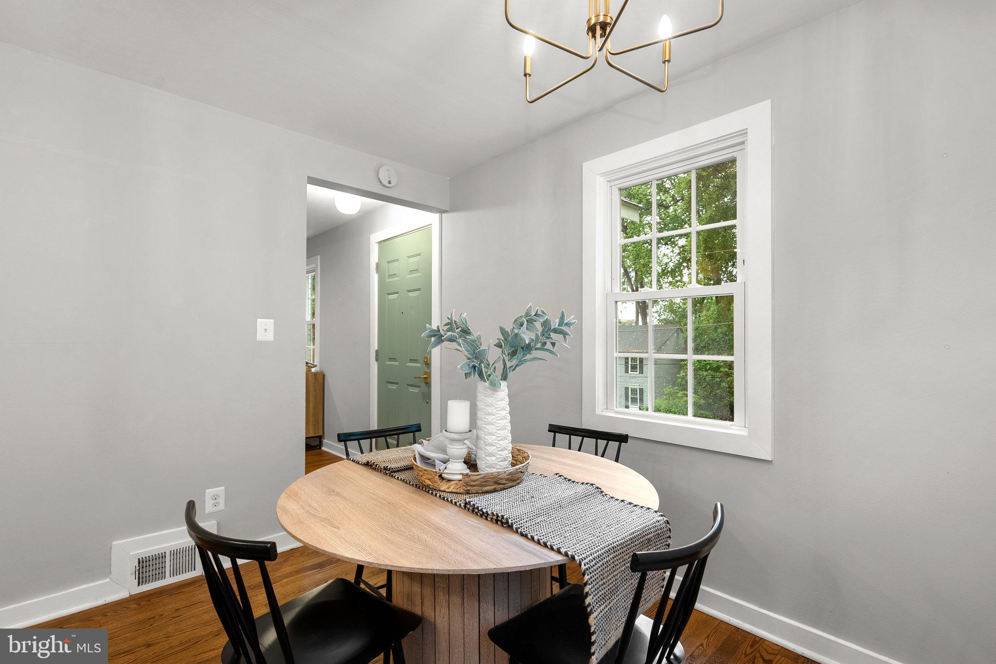 8713 Reading Road Silver Spring, MD 20901 - Photo 13 of 49 a view of a dining room with furniture window and outside view