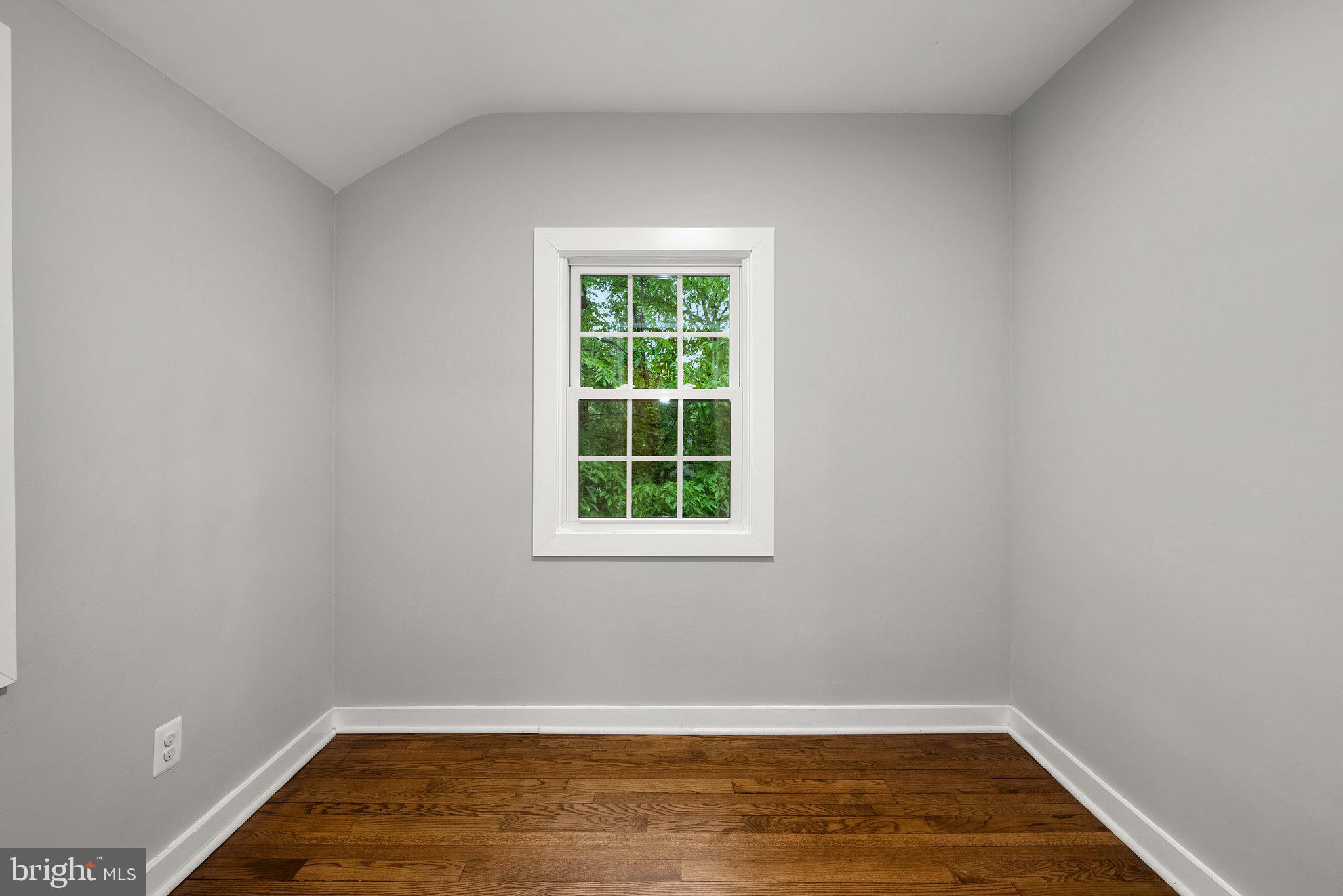 8713 Reading Road Silver Spring, MD 20901 - Photo 22 of 49 a view of a room with wooden floor and small window