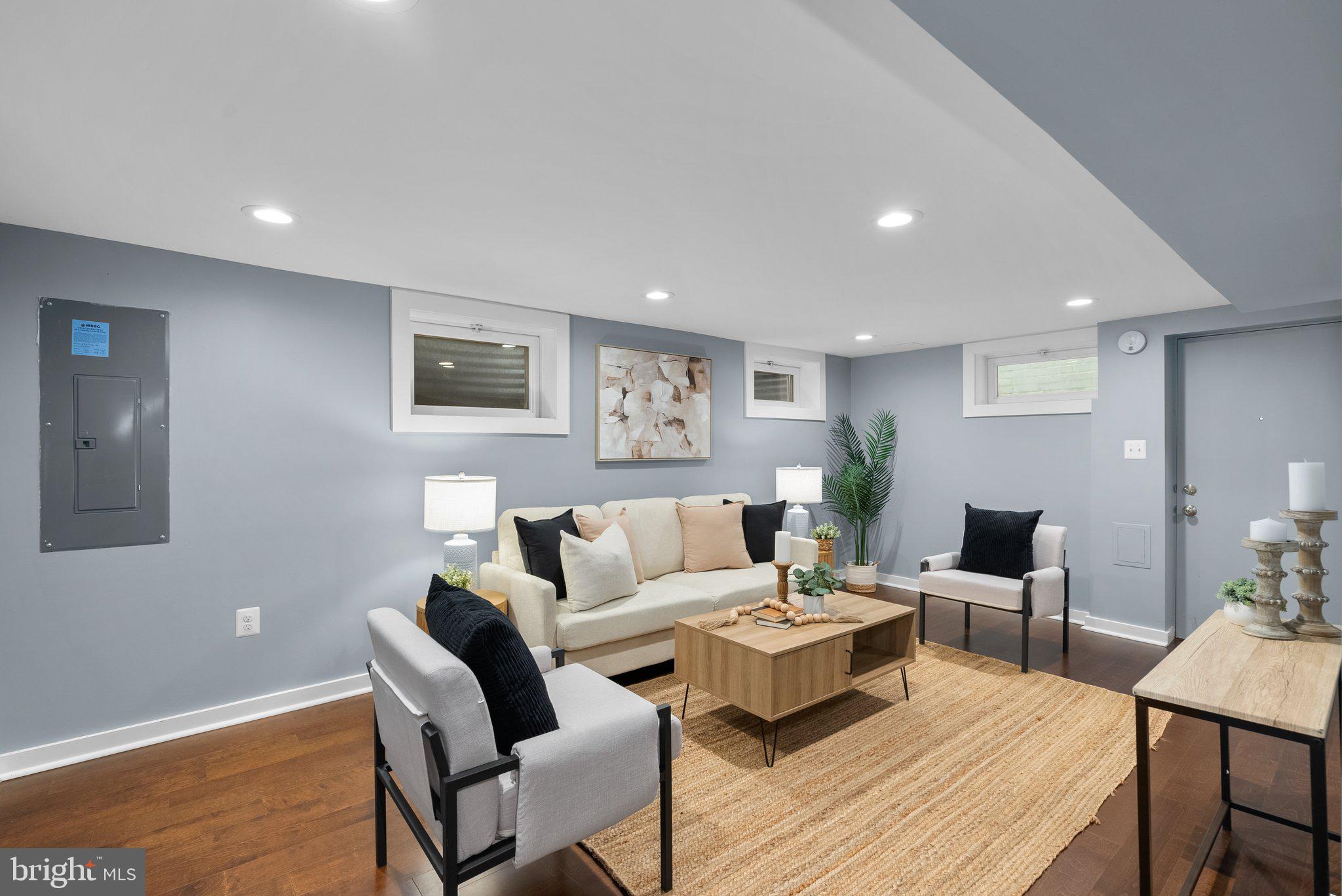 8713 Reading Road Silver Spring, MD 20901 - Photo 28 of 49 a living room with furniture and wooden floor