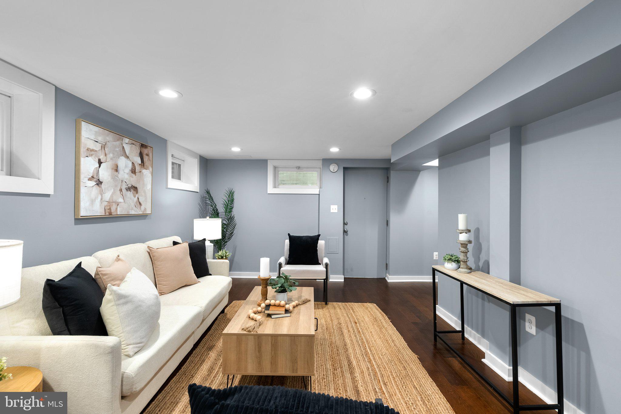 8713 Reading Road Silver Spring, MD 20901 - Photo 29 of 49 a living room with furniture and a wooden floor