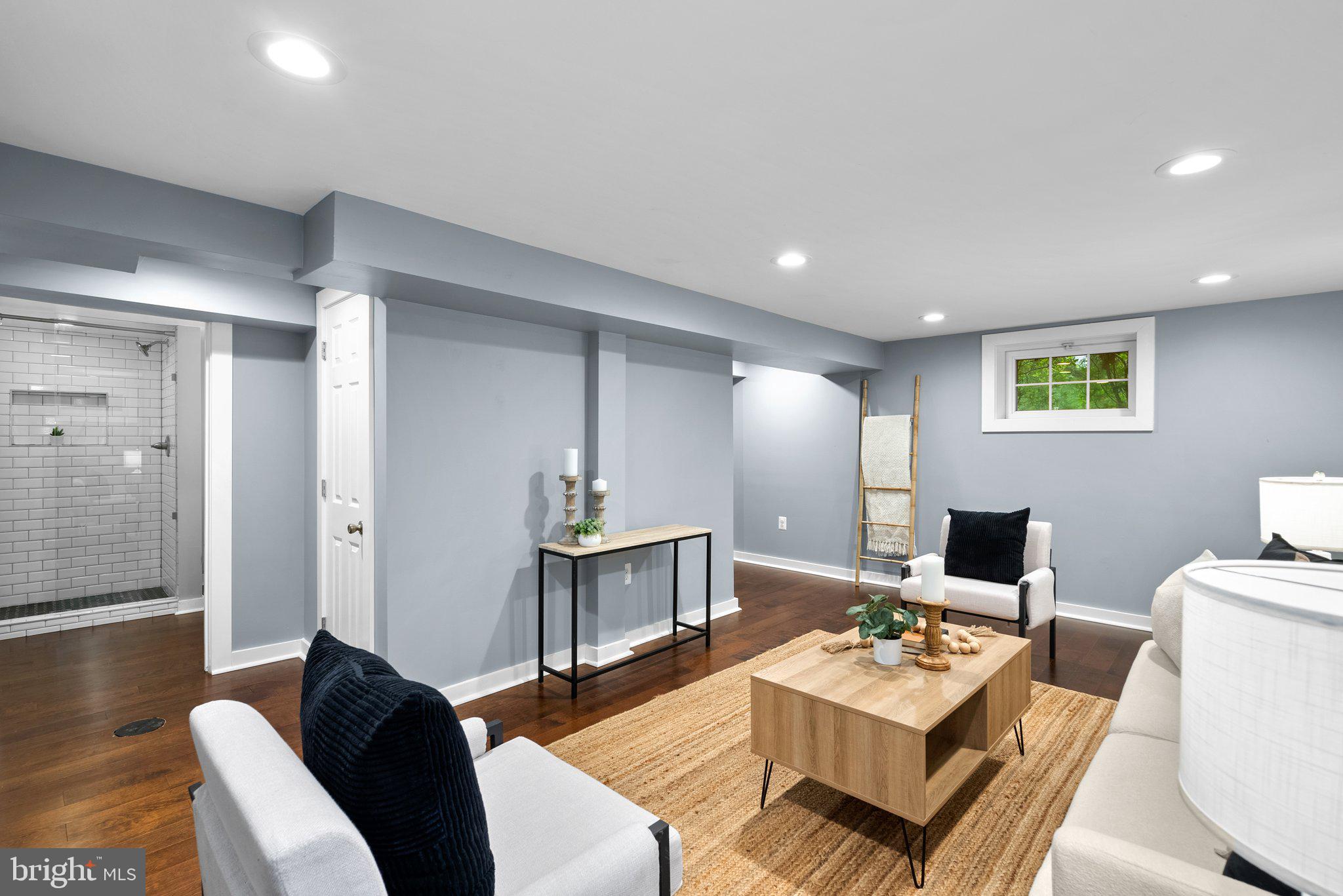 8713 Reading Road Silver Spring, MD 20901 - Photo 32 of 49 a living room with furniture and a table