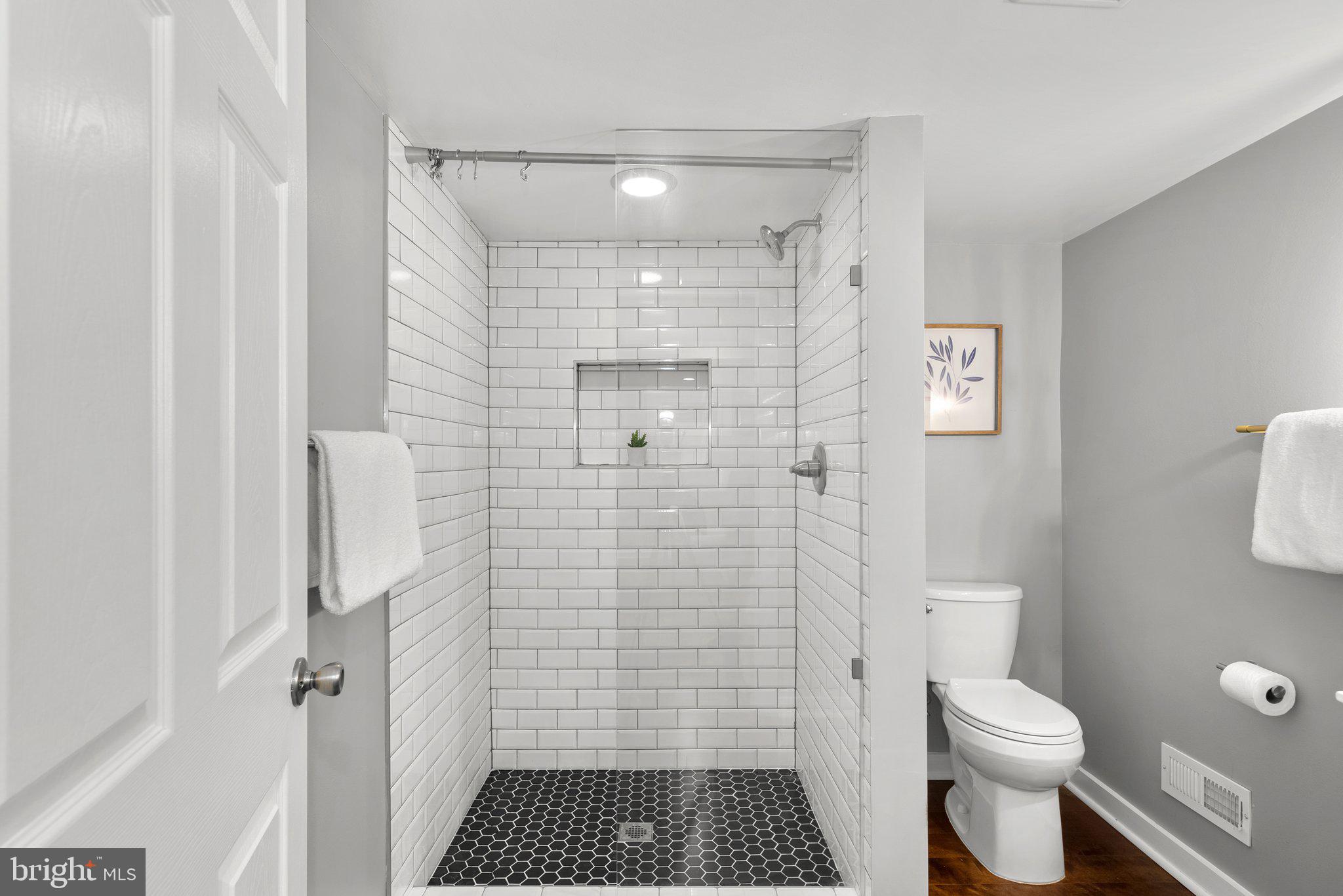 8713 Reading Road Silver Spring, MD 20901 - Photo 33 of 49 a bathroom with a toilet and a shower