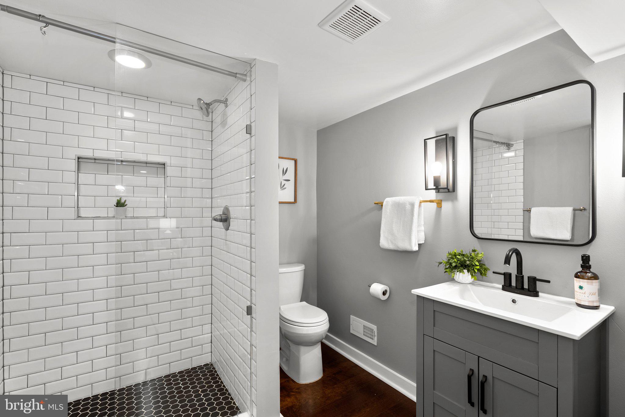 8713 Reading Road Silver Spring, MD 20901 - Photo 34 of 49 a bathroom with a sink a toilet and shower