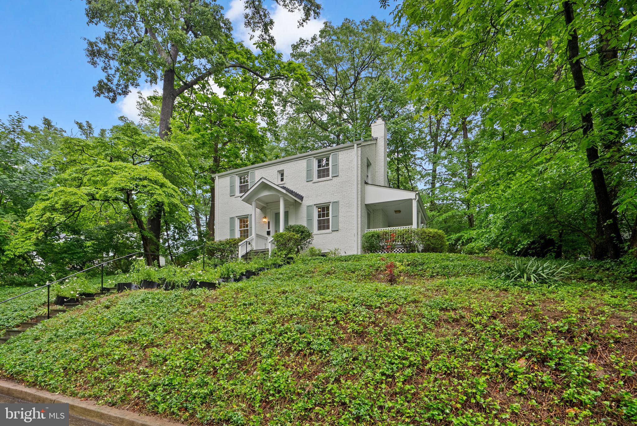 8713 Reading Road Silver Spring, MD 20901 - Photo 5 of 49 a front view of a house with a yard