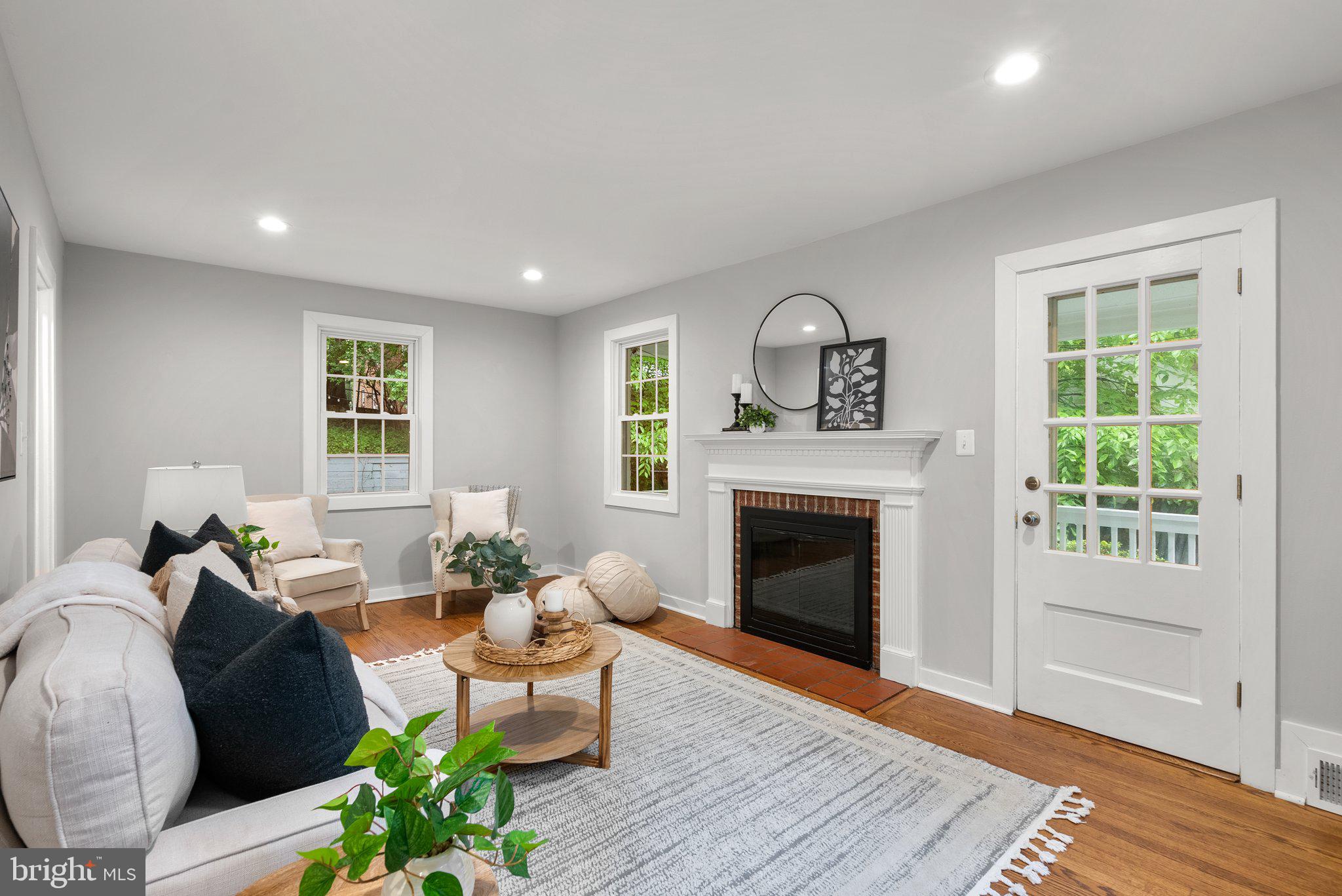 8713 Reading Road Silver Spring, MD 20901 - Photo 6 of 49 a living room with furniture and a fireplace