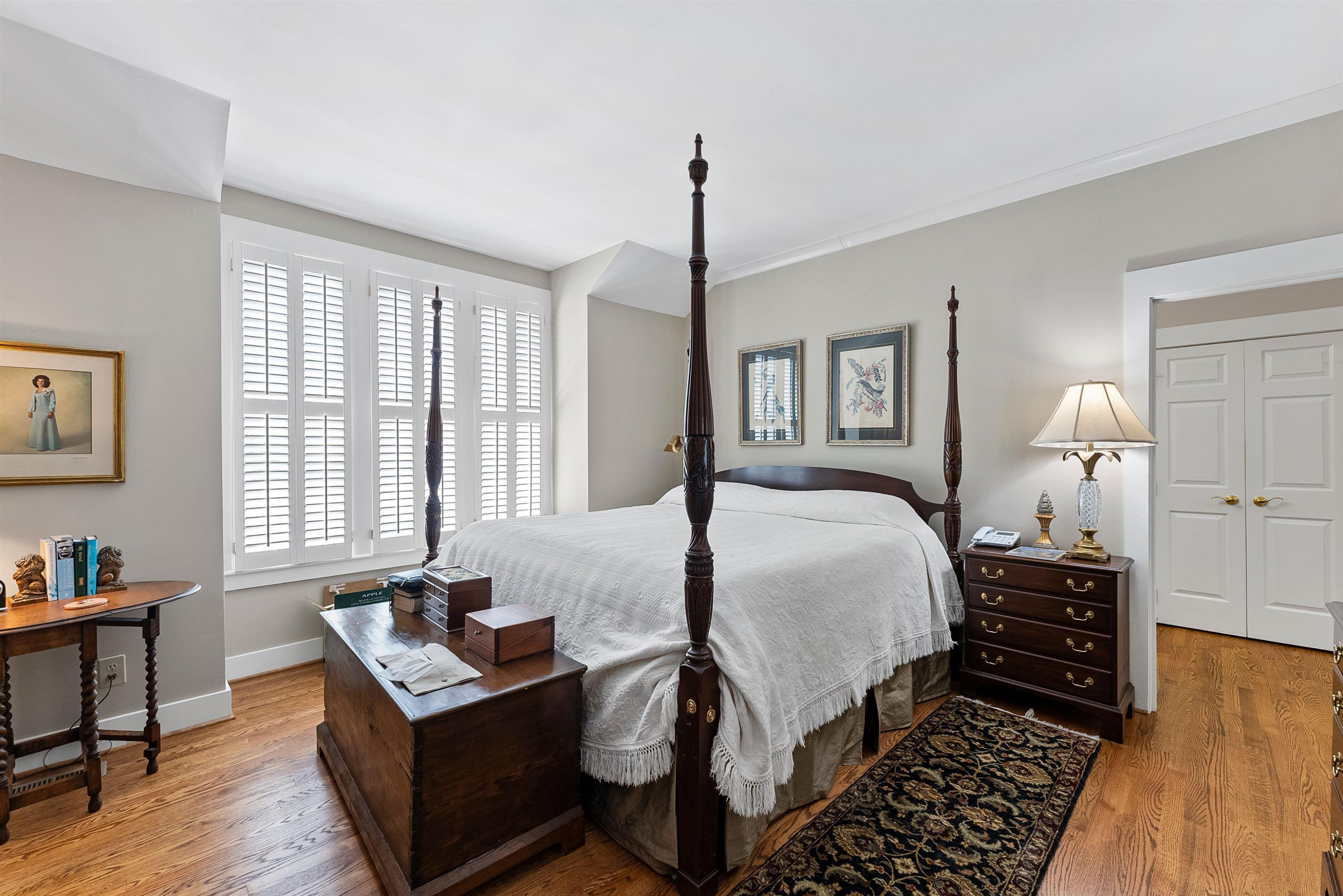 6007 Sentinel Drive Raleigh, NC 27609 - Photo 24 of 33 Beautiful Master with large windows, plantation shutters, hardwood floors & his & hers closets First Floor Owner's Suite