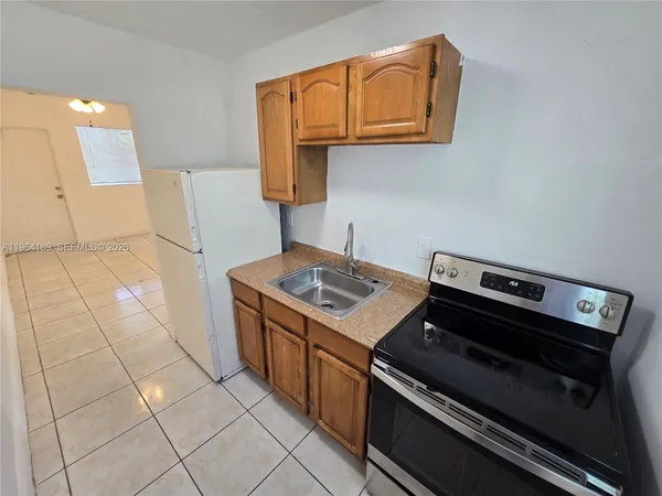 a kitchen with a stove and a microwave