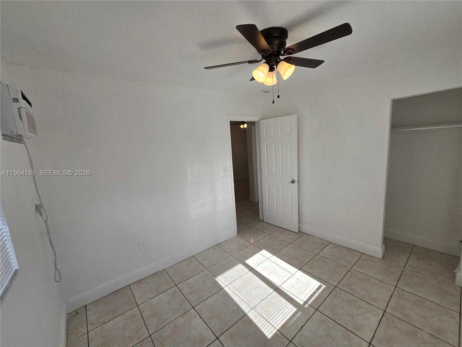 535 Northwest 7th Street, Unit 9 Miami, FL 33136 - Photo 14 of 22 a view of livingroom with ceiling fan