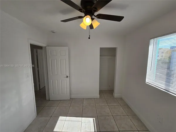 a living room with a chandelier furniture and a window