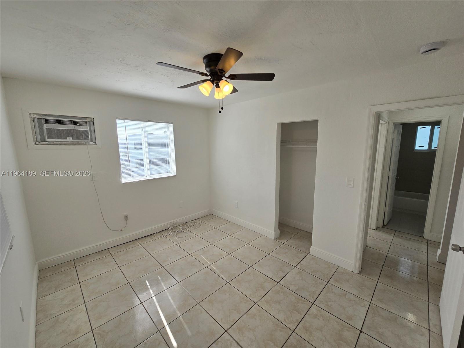 535 Northwest 7th Street, Unit 9 Miami, FL 33136 - Photo 16 of 22 a view of empty room with wooden floor