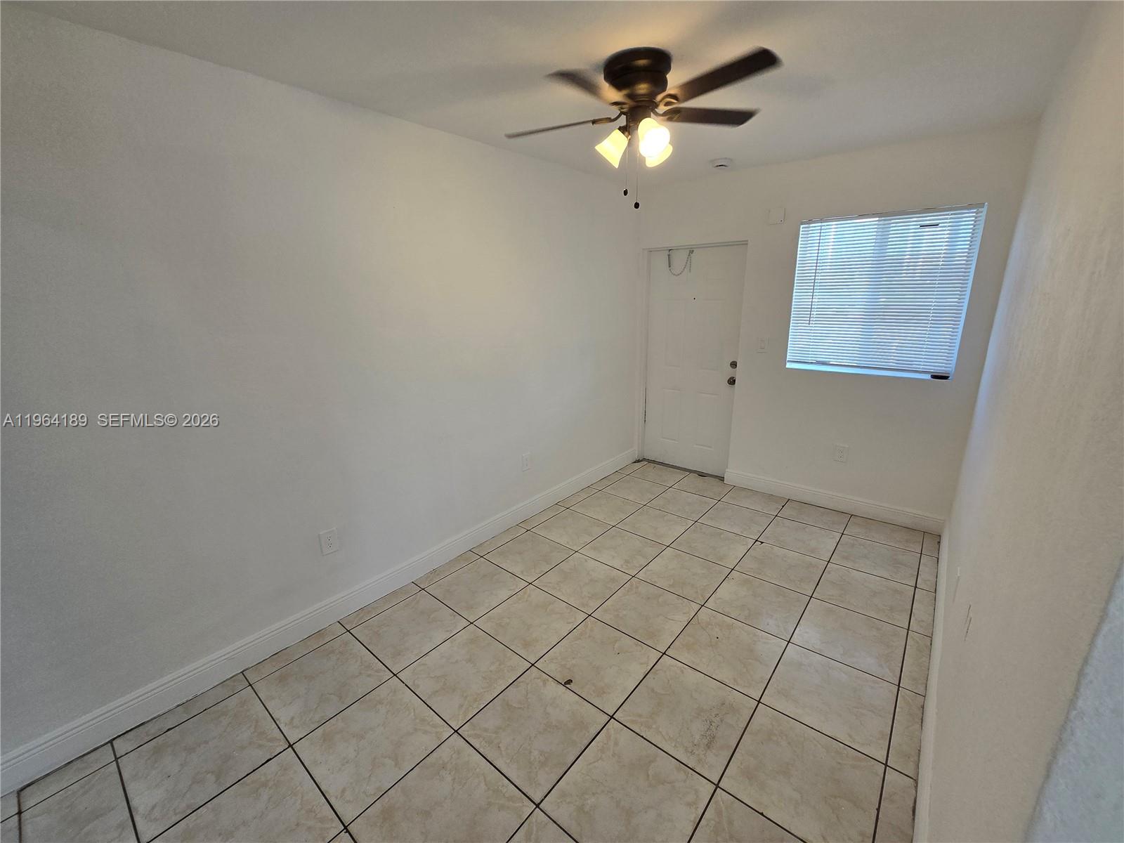 535 Northwest 7th Street, Unit 9 Miami, FL 33136 - Photo 8 of 22 an empty room with windows