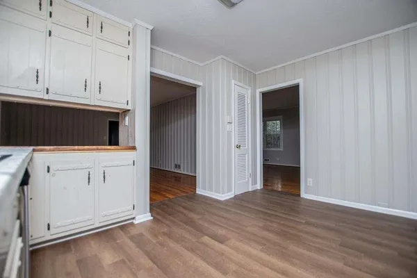 a view of a bathroom with wooden floor