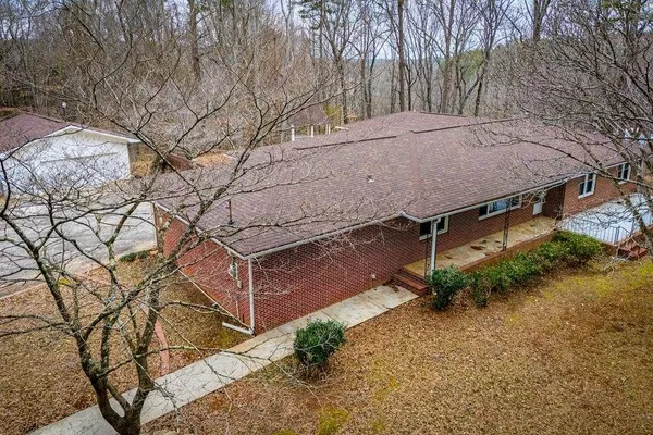 a view of a house with a yard and plants