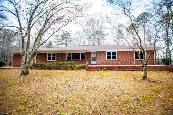 a aerial view of a house with yard and sitting area