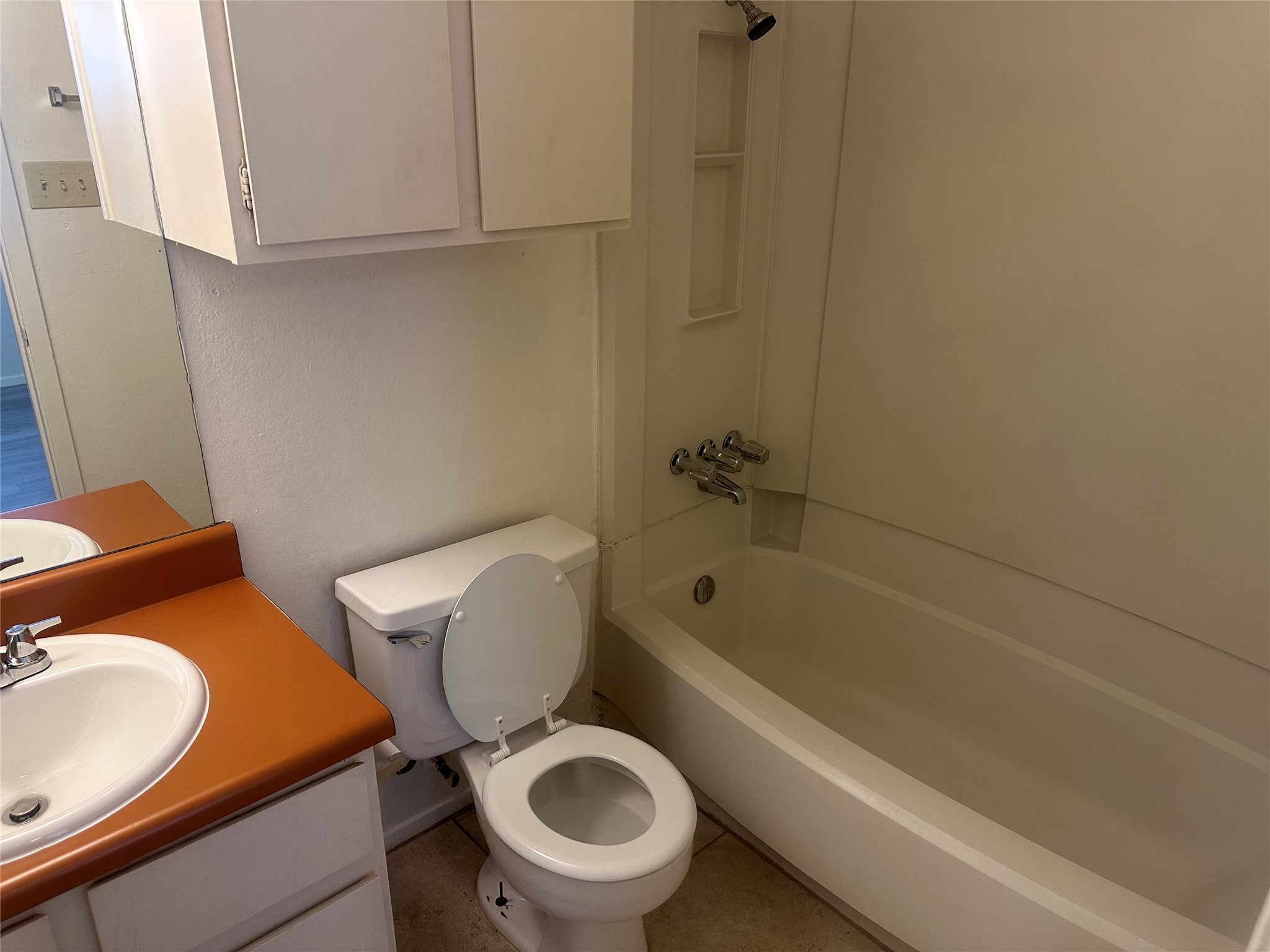 2602 South Bagdad Road, Unit B Leander, TX 78641 - Photo 10 of 23 Functional layout incorporates a full tub shower combination and integrated vanity space.
