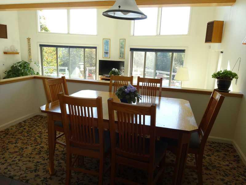 339 Mudgett Road Newburgh, ME 04444 - Photo 9 of 32 View of floor to ceiling windows and...