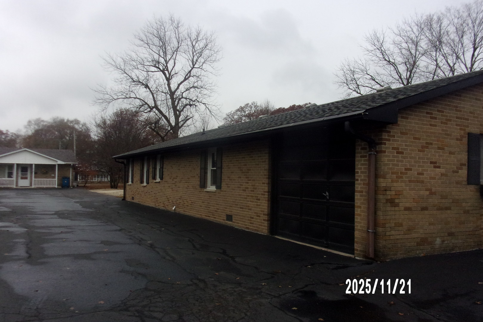 a backyard of a house with large trees