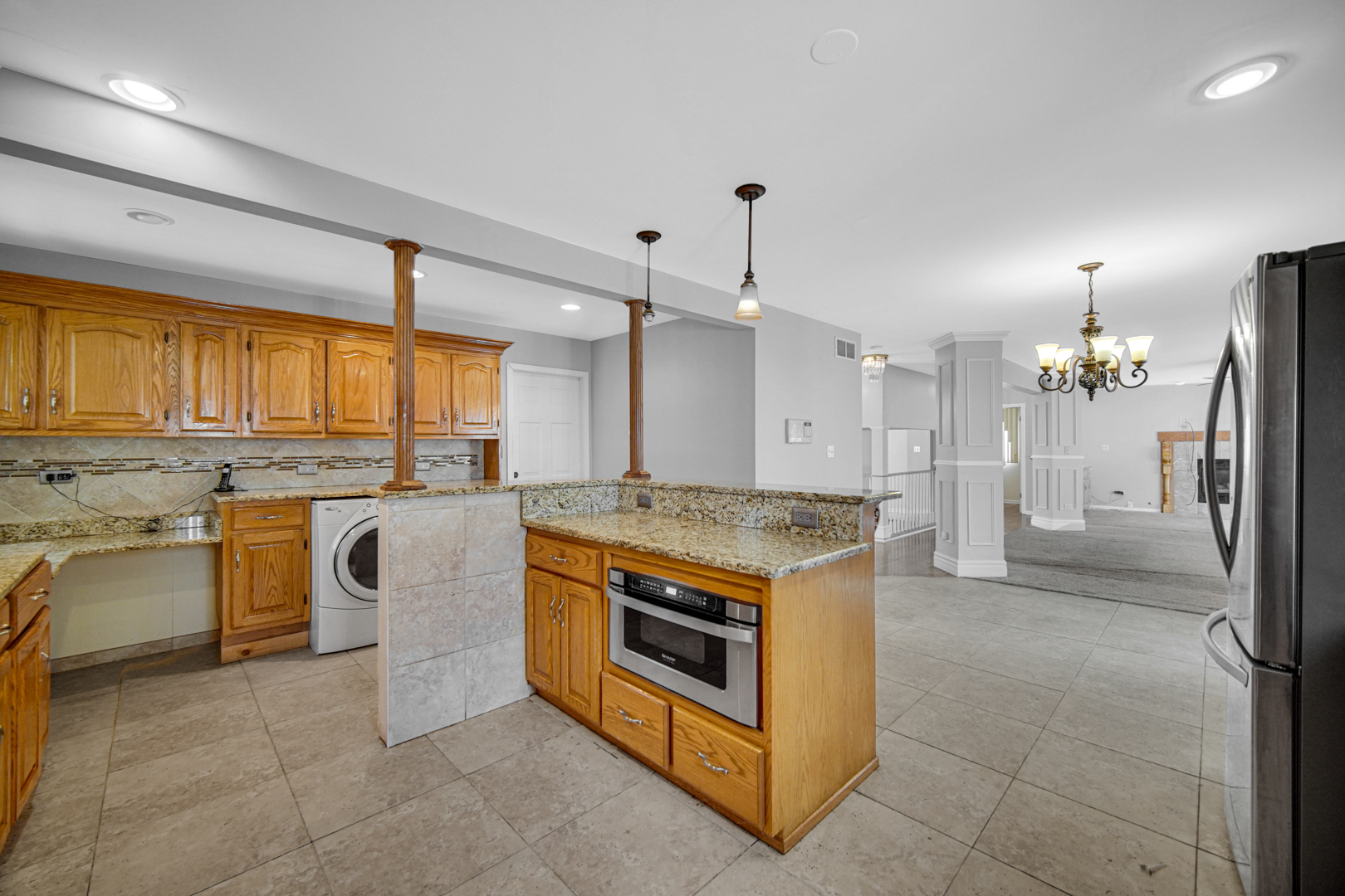 15516 Frontage Road Markham, IL 60428 - Photo 13 of 36 a kitchen with stainless steel appliances granite countertop a stove a sink and a refrigerator