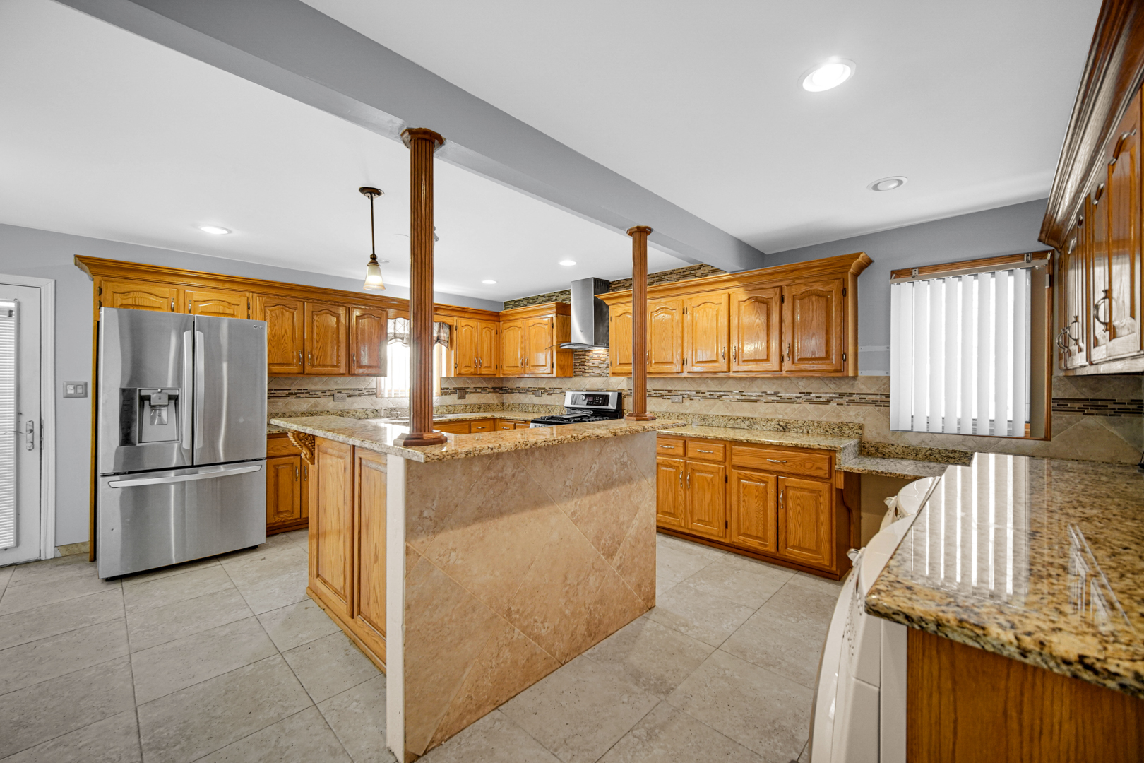 15516 Frontage Road Markham, IL 60428 - Photo 15 of 36 a kitchen with stainless steel appliances granite countertop a refrigerator a sink and white cabinets