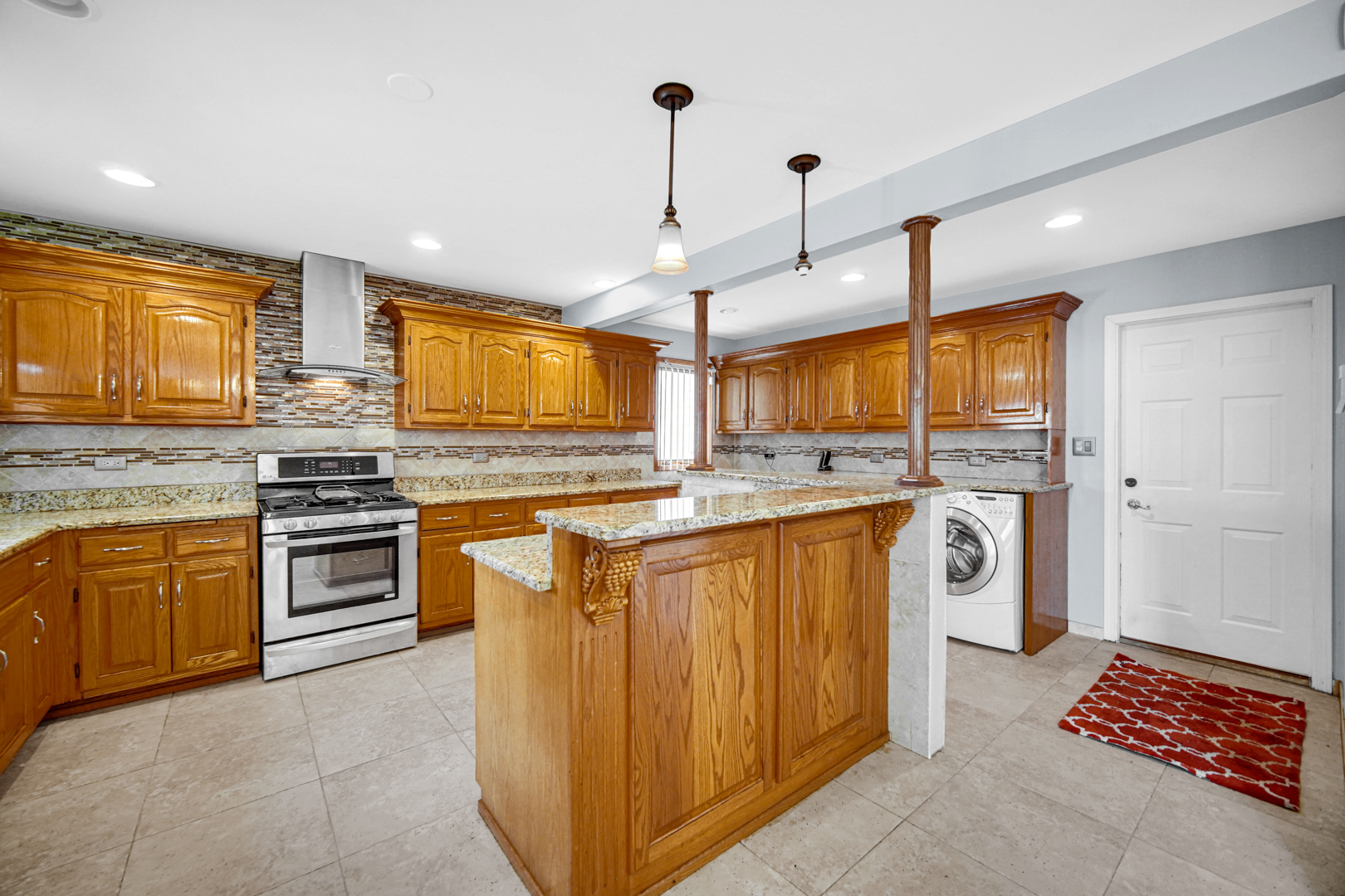 15516 Frontage Road Markham, IL 60428 - Photo 16 of 36 a kitchen with stainless steel appliances granite countertop a stove a sink and a refrigerator