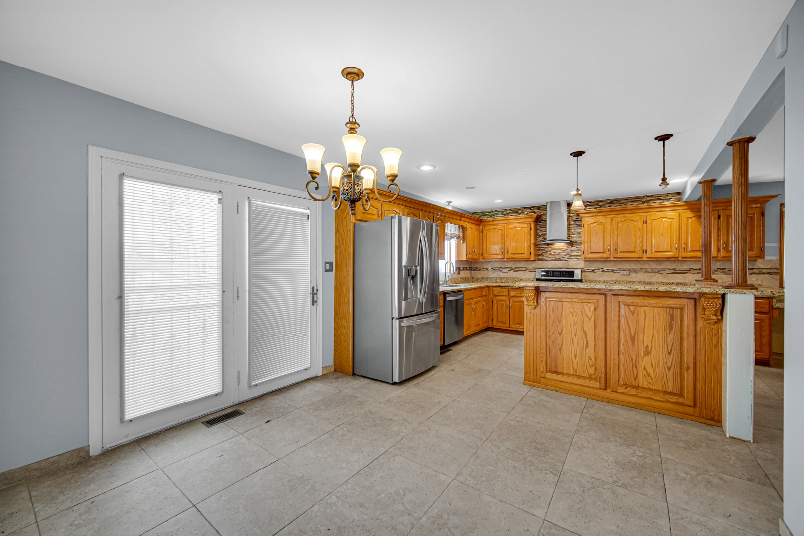 15516 Frontage Road Markham, IL 60428 - Photo 18 of 36 a view of a kitchen with refrigerator and cabinets
